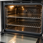 Sparkling clean oven shelves placed back inside the oven